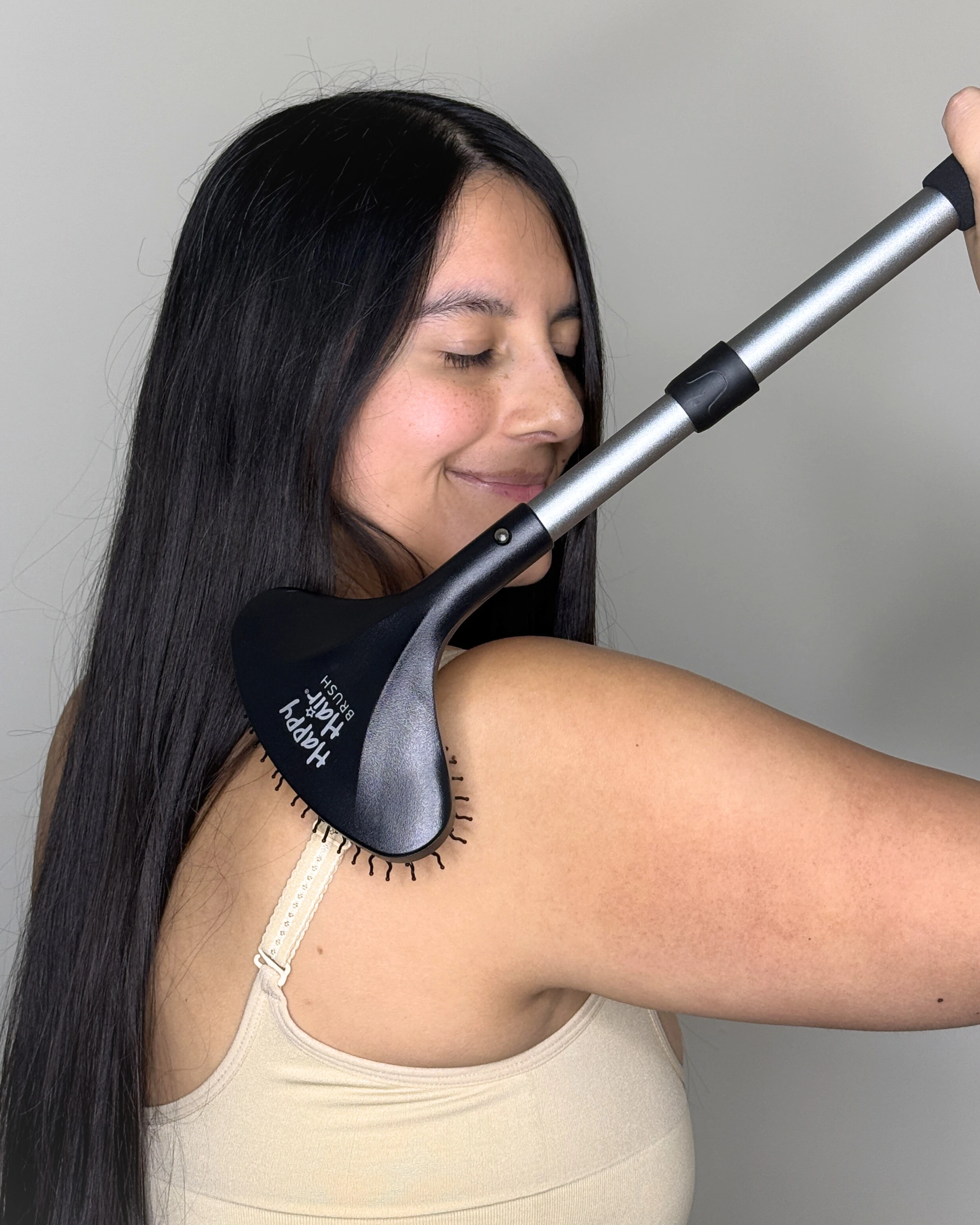 Photographer and model for the Back Scratcher by Happy Hair Brush.