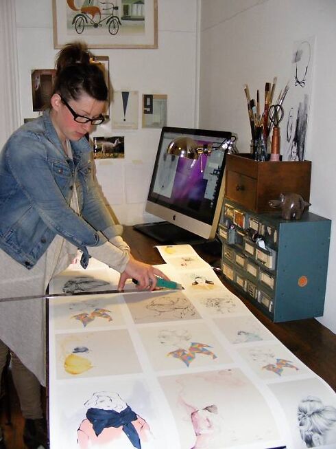 The artist herself, cutting down the roll.