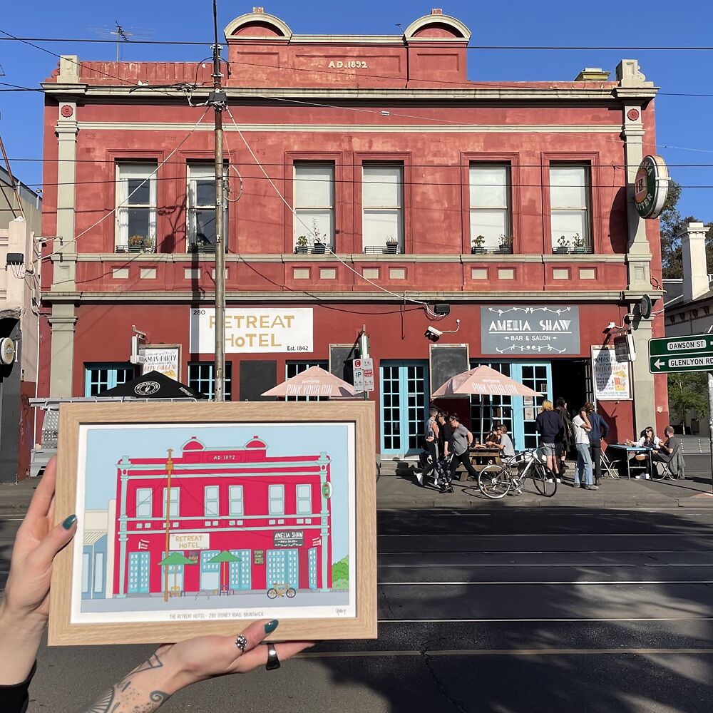 Laura Holley with her print of the iconic Retreat Hotel in Brunswick