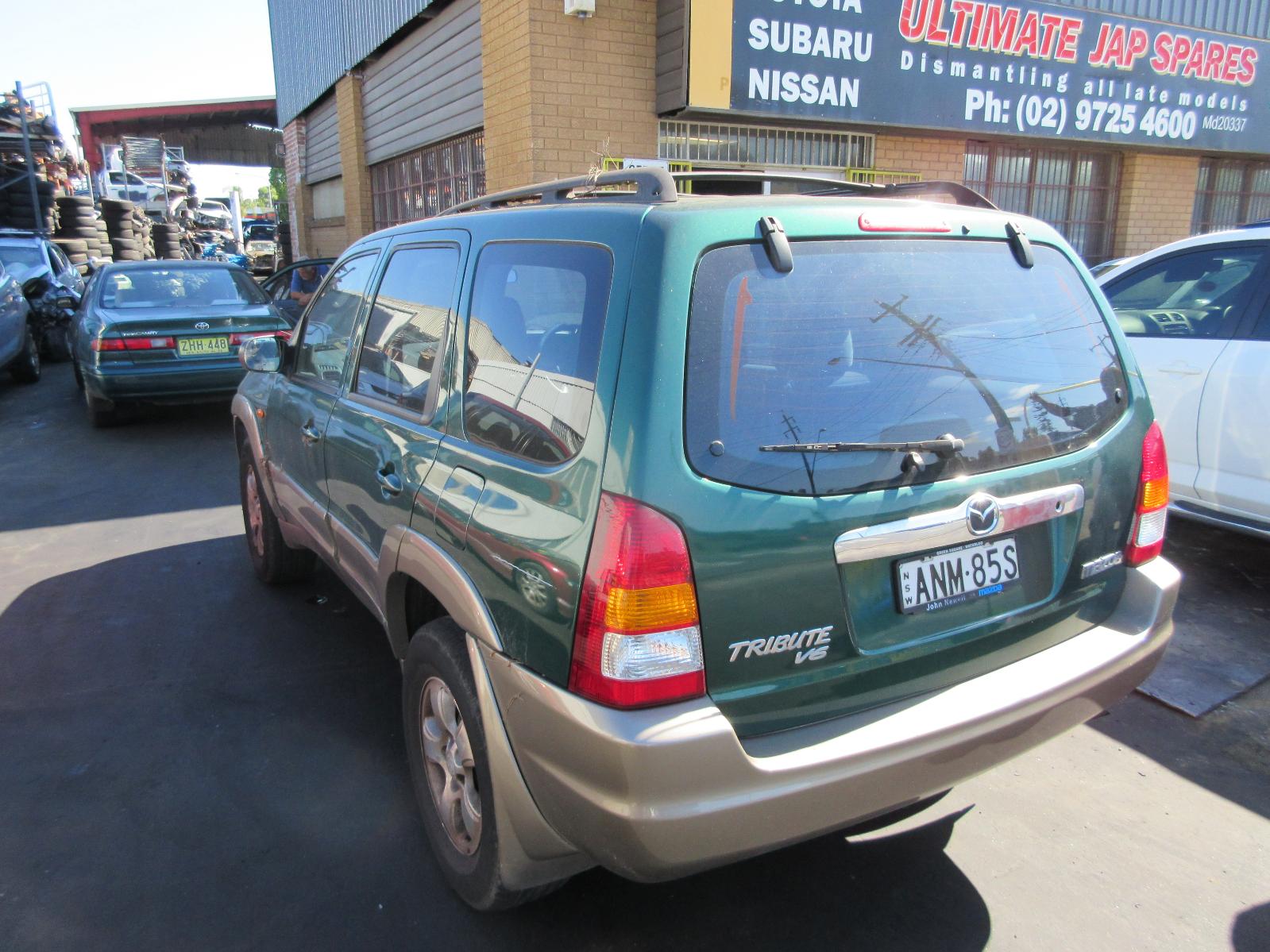 View Auto part Right Headlamp Mazda Tribute 2002