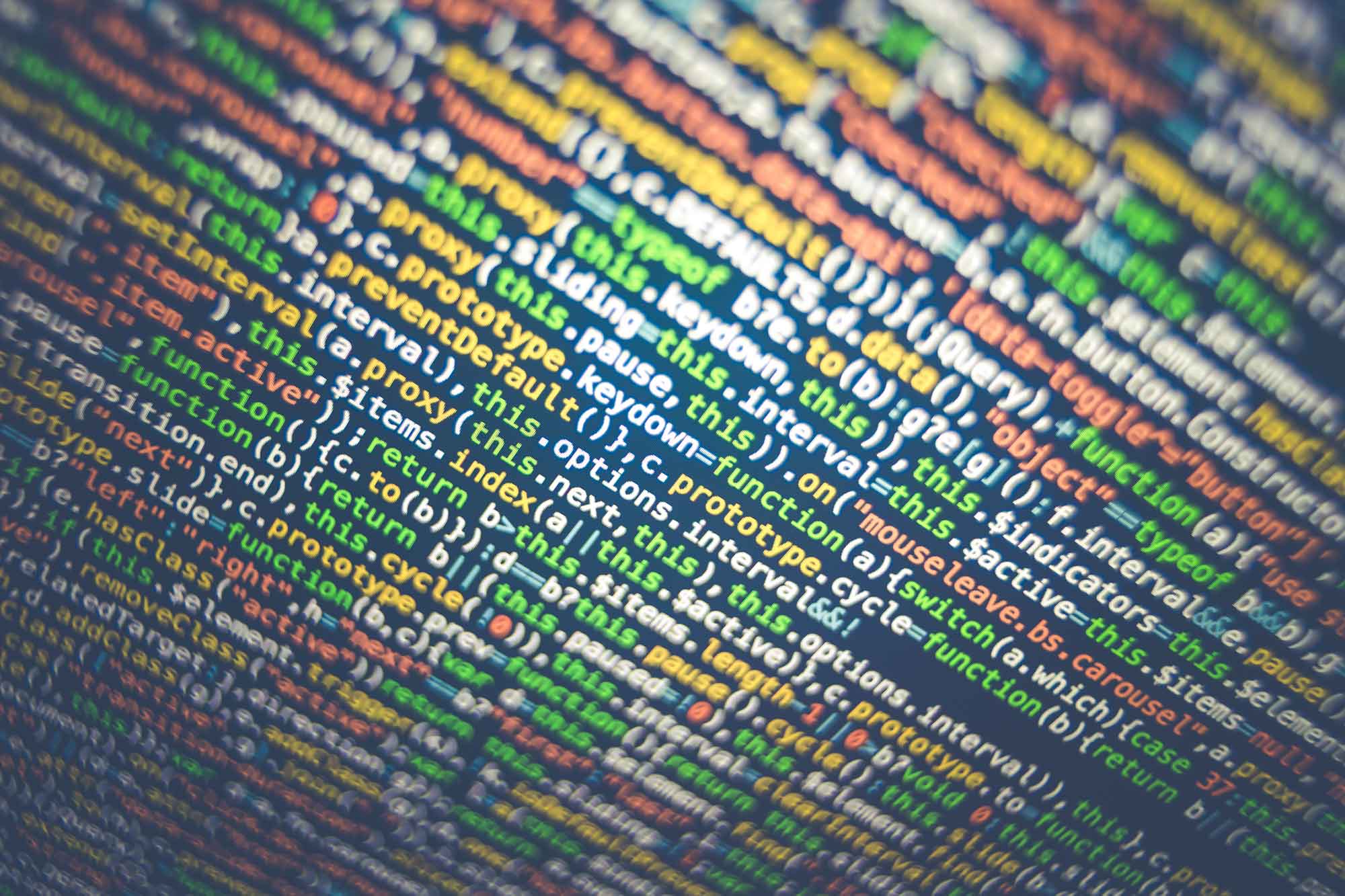 Closeup of a screen full of colourful code Closeup of a screen full of colourful code
