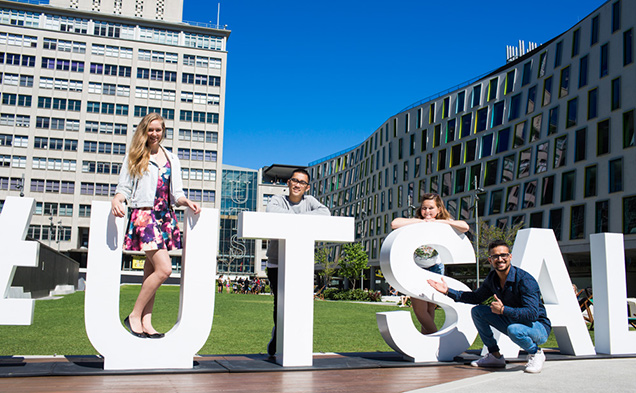UTS International students sitting on grass