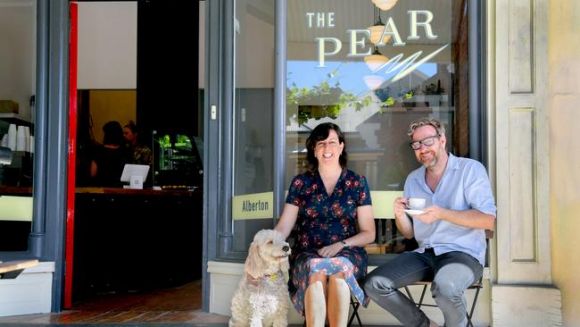 Christie Anthony and Joost den Hartog and Pedro the Groodle at their new coffeeshop The Pear Cafe at the Alberton train station. Photo: AAP Image/ Morgan Sette Find a regular cafe/grocer