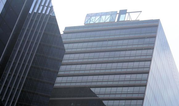 Test facade panels atop Tower 1, Collins Square Collins Square approved one day, under construction the next