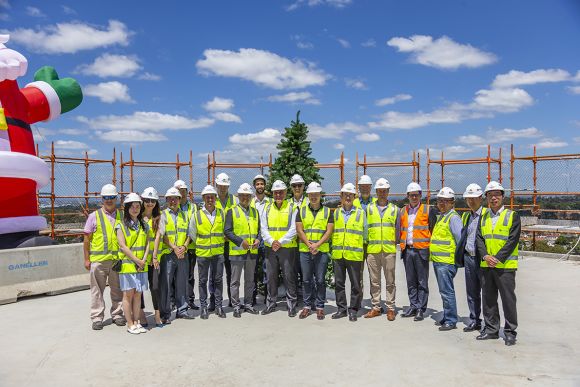 Representatives from the project team at the topping out ceremony. Image Ganellen tops out Stage 1 of Greenland's Macquarie Park project