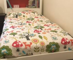 Single bed with blue inlaid headboard