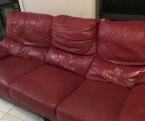 Red three seater couch