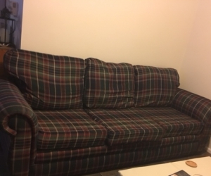 Large long couch, checked fabric, old but sturdy.