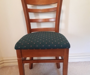 Upolstered green modern timber dining chair with curved back