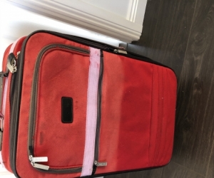 Red fabric suitcase