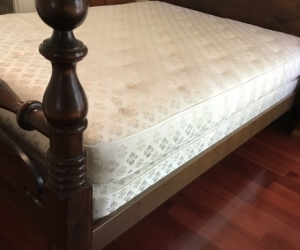 Queen size dark wooden frame bed