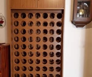 Wine rack, holds 63 bottles with cupboards
