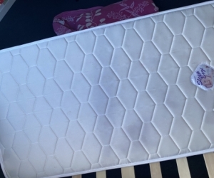 Toddler bed with mattress.