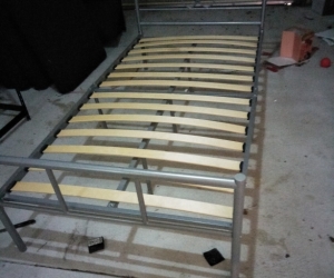 Single bed, outdoor setting, cabinet