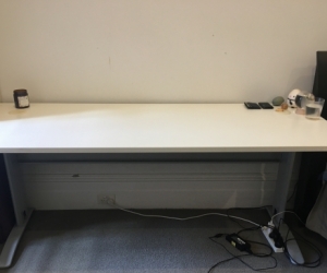 Modern white desk with cable holes