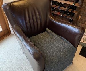 Very comfy armchair, leather peeling