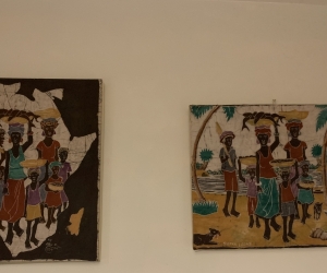 Two African prints Cloth mounted on canvas