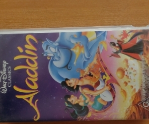 Aladdin poster in frame & VHS Video of Disney's Aladdin