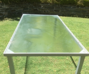 Glass top outdoor table